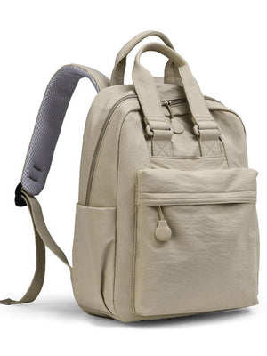 Mini Oxford cloth backpack in beige with front pocket and padded straps