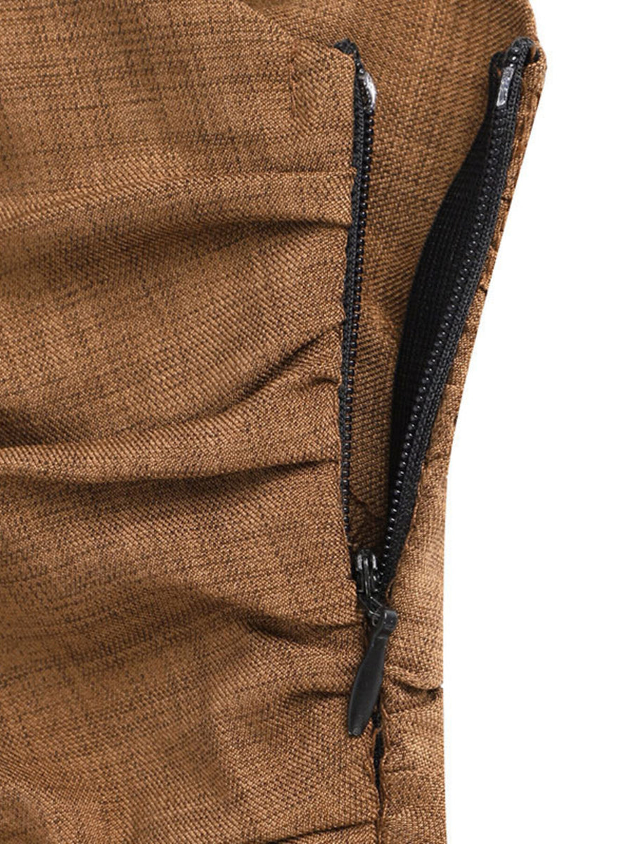 Brown one-shoulder wide leg jumpsuit with ruched detail and side zipper.