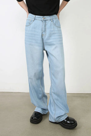 Light wash wide-leg denim jeans with a relaxed fit and casual styling.
