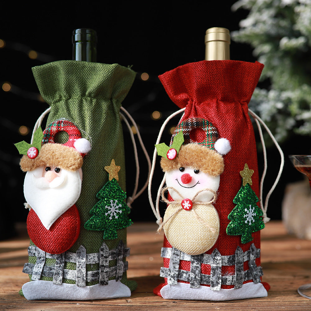Festive wine bottle gift bags in Santa and Snowman designs, with Christmas tree and fence details.