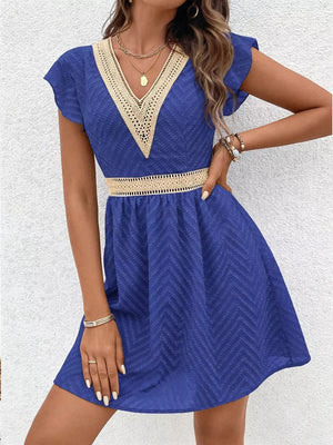 Royal blue chevron textured mini dress with V-neck and defined waist with crochet trim