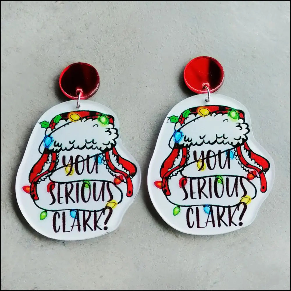 Holiday graphic acrylic statement earrings with Christmas lights and text.