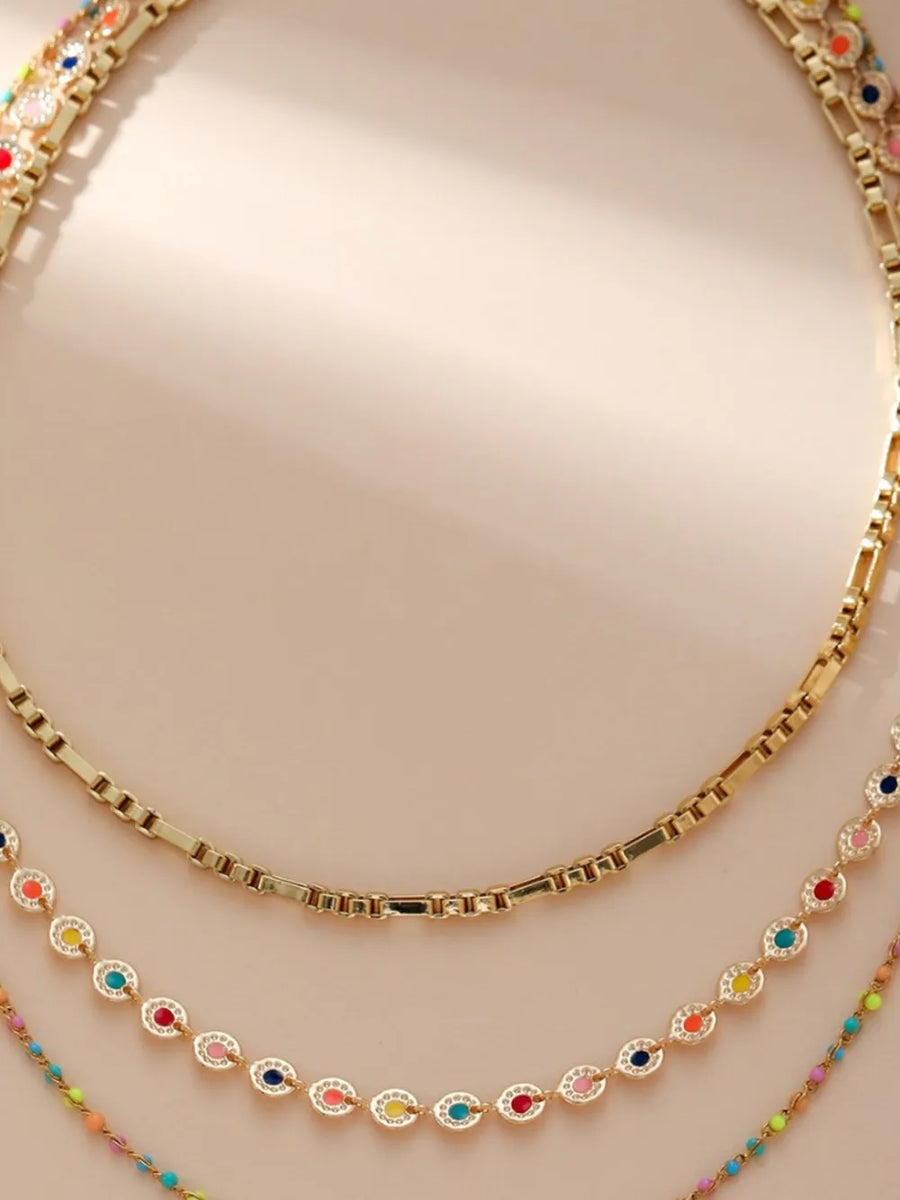 18K Gold-Plated,Resin,Stainless Steel Care instructions: Avoid wearing during ex necklace in gold with layered silhouette