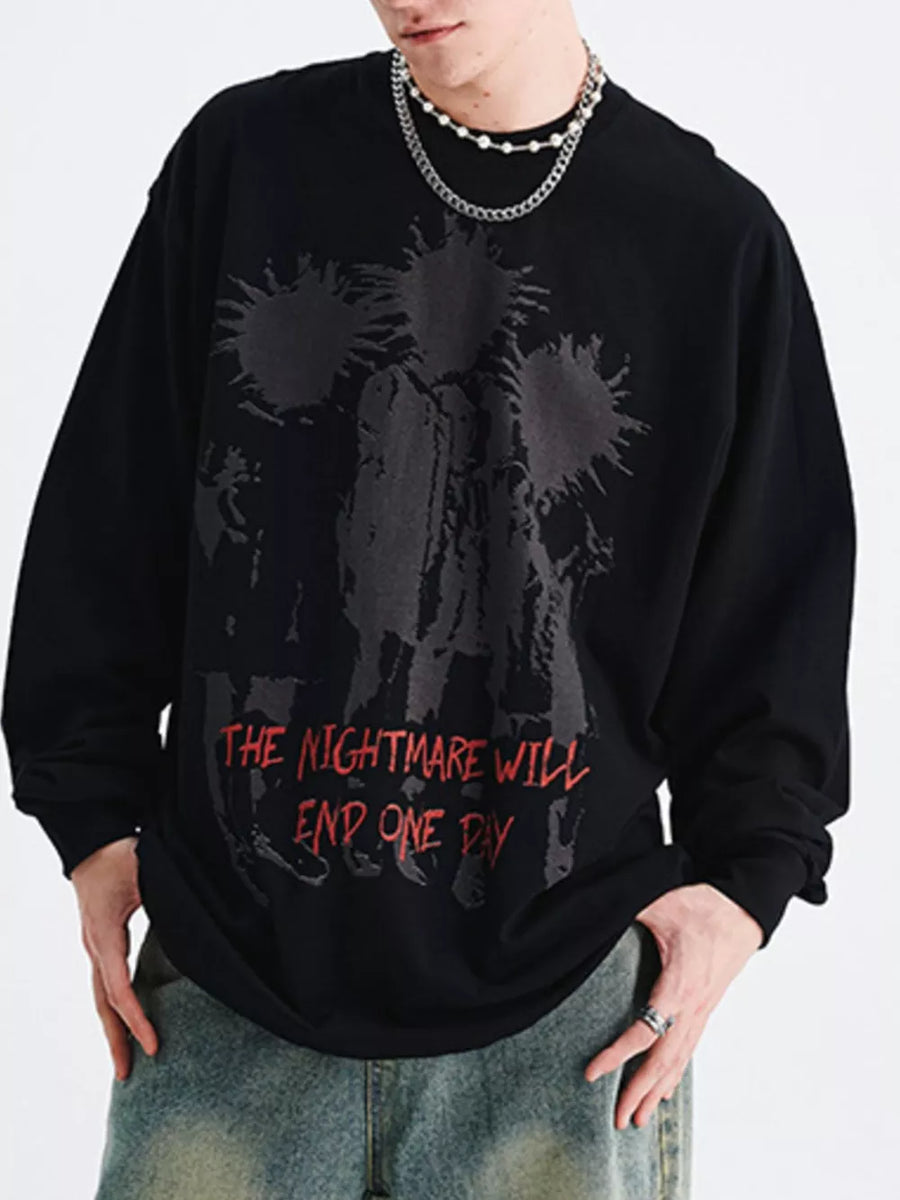 Black oversized long sleeve t-shirt with graphic print and red text.
