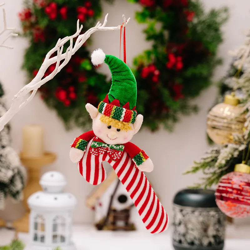 Elf cane holiday ornament with red and white stripes and a cheerful face.