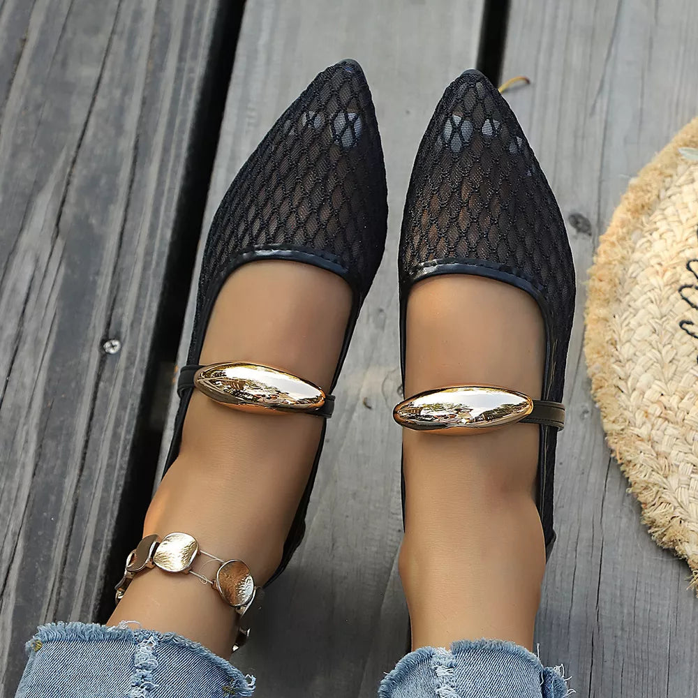 flats in black with geometric and pointed toe