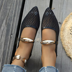 flats in black with geometric and pointed toe