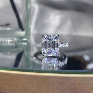 ring in silver featuring emerald cut stone and straight fit