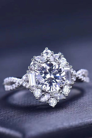 Silver floral halo twist ring with round and baguette cut stones