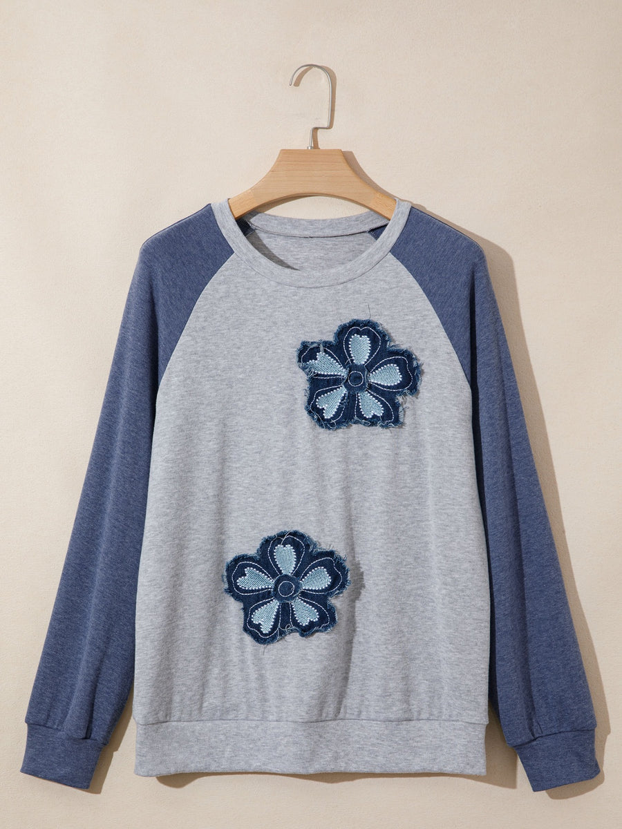 Raglan shirt with two denim flower patches on gray body and blue sleeves