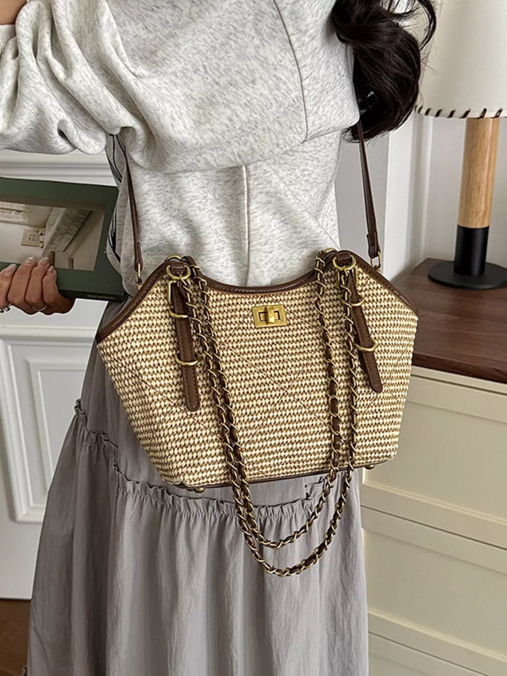 dark brown crossbody bag featuring woven texture and geometric