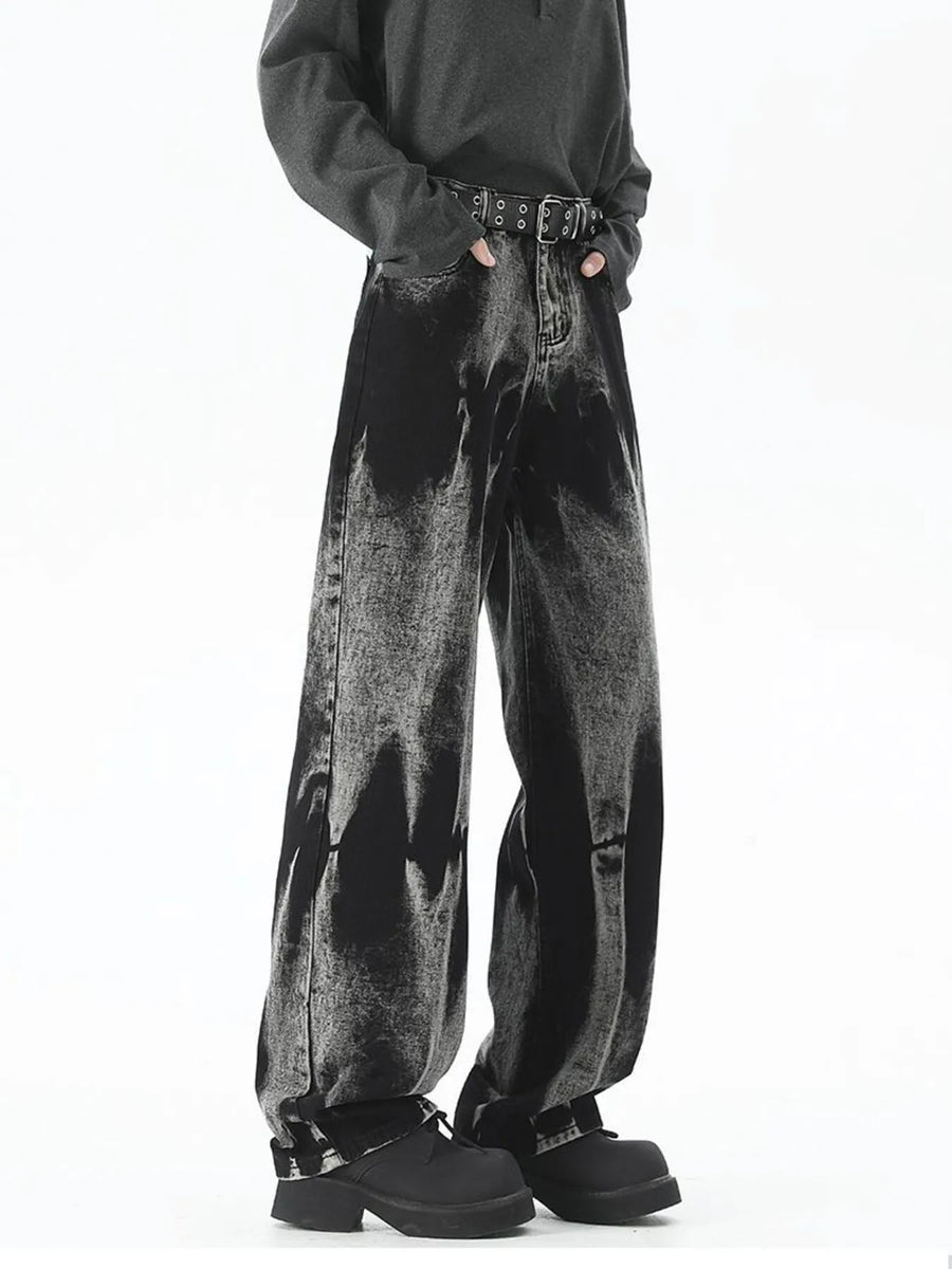 Men's plus-size relaxed fit black acid wash jeans with a belted waist.