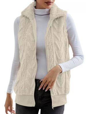 Off-white faux fur zip-up vest with textured pattern and collared neckline.
