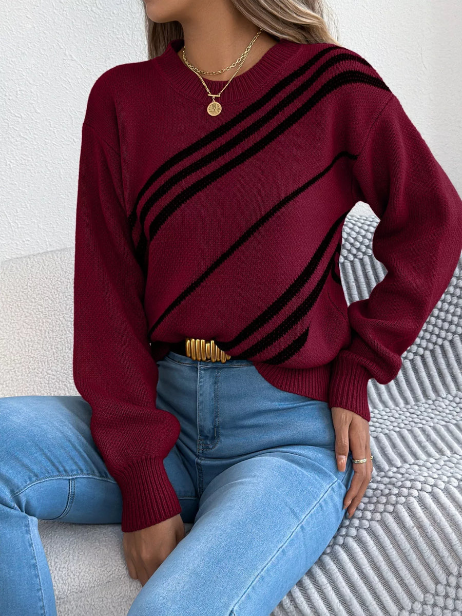 Red striped casual round-neck sweater with black diagonal stripes, acrylic blend.