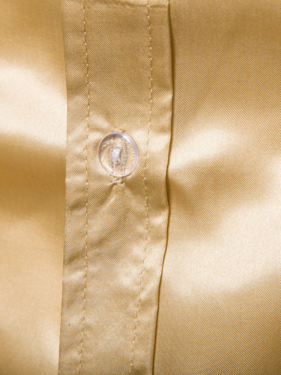 Men's yellow satin button-down shirt with a clear button detail.