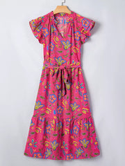 Floral midi dress with ruffled sleeves, V-neck, tie waist, and tiered hem in cotton blend.