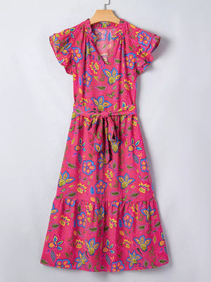 Floral midi dress with ruffled sleeves, V-neck, tie waist, and tiered hem in cotton blend.