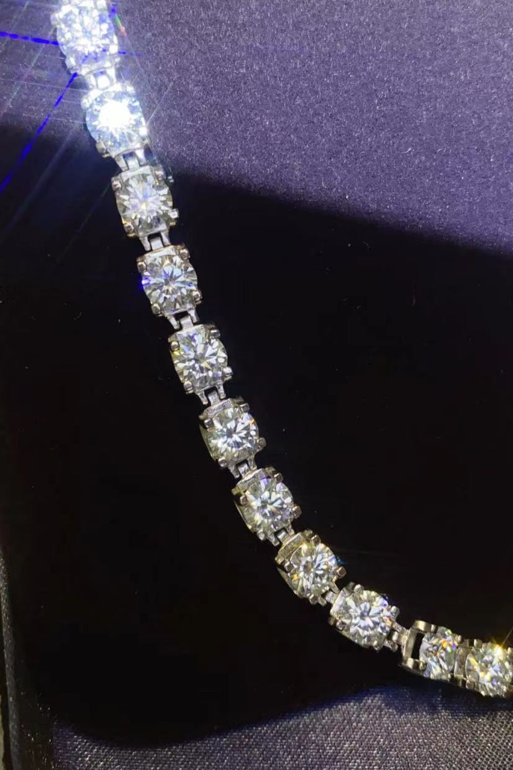 Diamond tennis bracelet in platinum with round-cut stones.