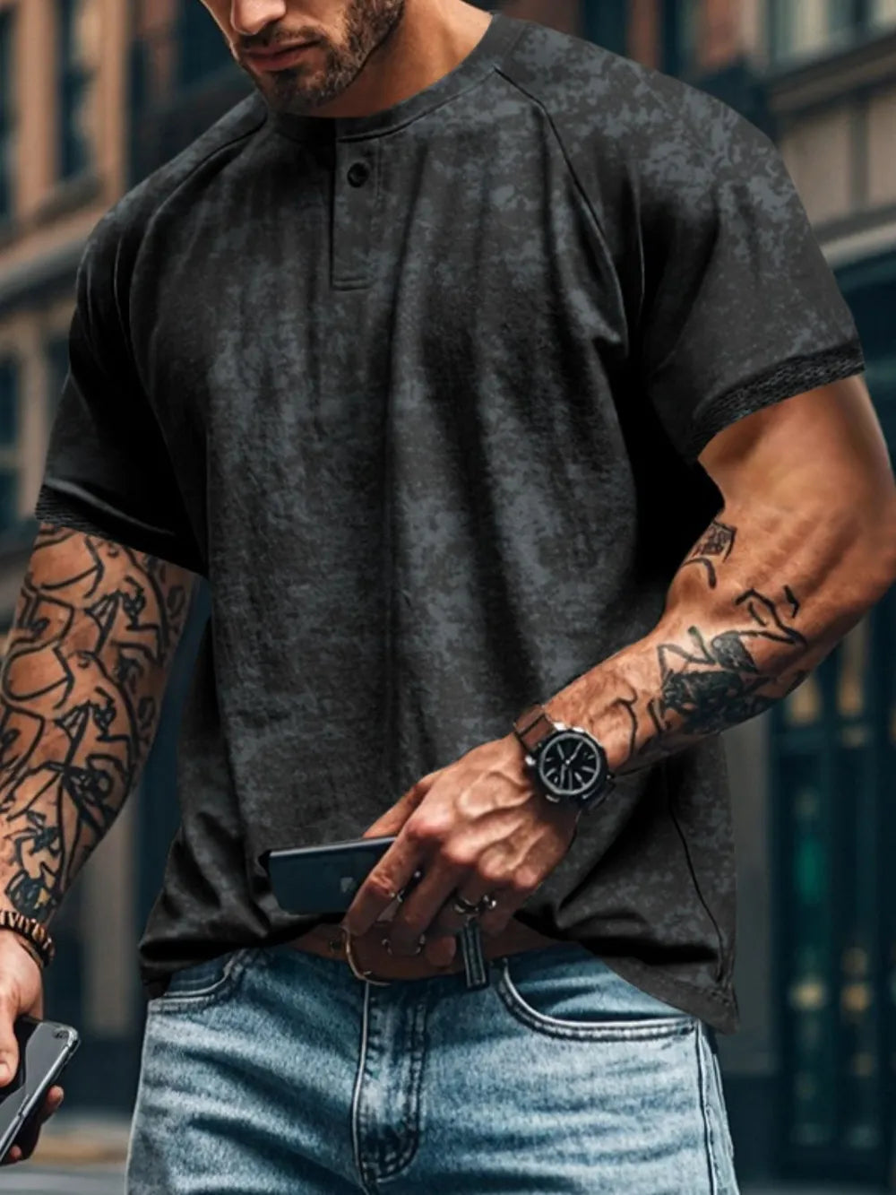 Textured black henley tee with raglan sleeves and button placket.