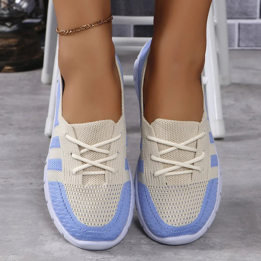 Breathable knit lace-up sneakers in beige and light blue with white laces.