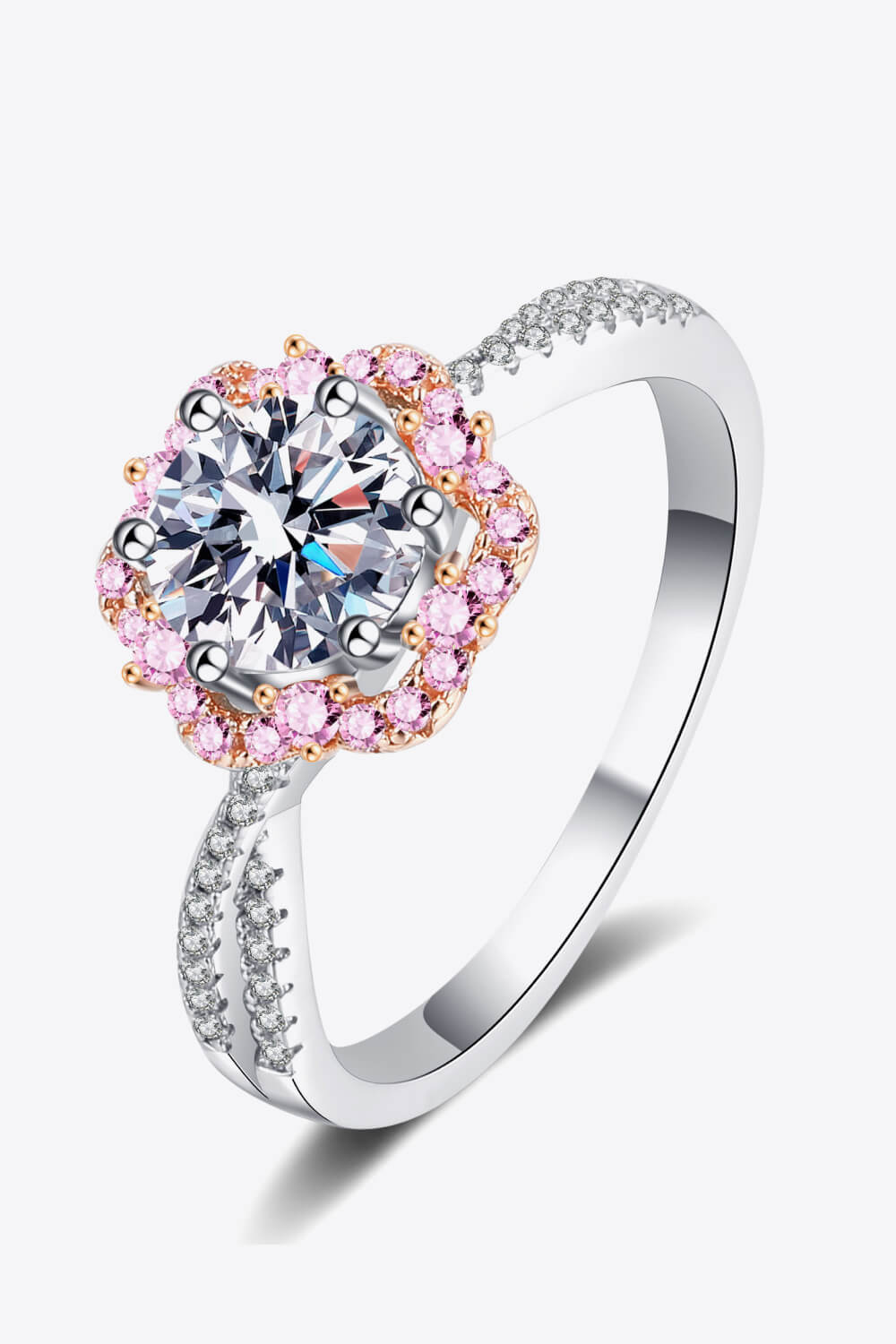 Silver moissanite ring with pink halo and diamond band.