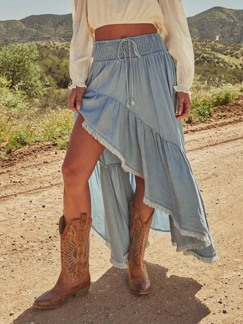 maxi skirt in light blue featuring raw hem and A-line fit