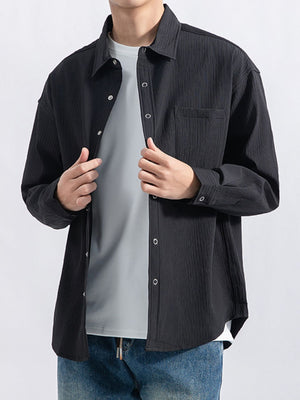 black button-down shirt with textured and collared