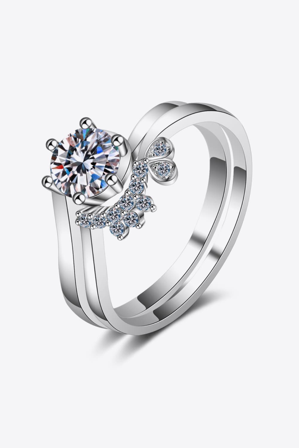 Silver moissanite ring set with butterfly accent and clear stones