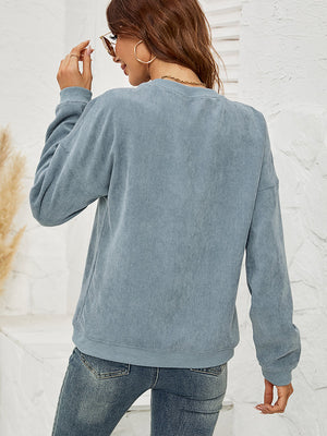Textured corduroy crewneck sweatshirt in French Blue with crew neck and long sleeves.