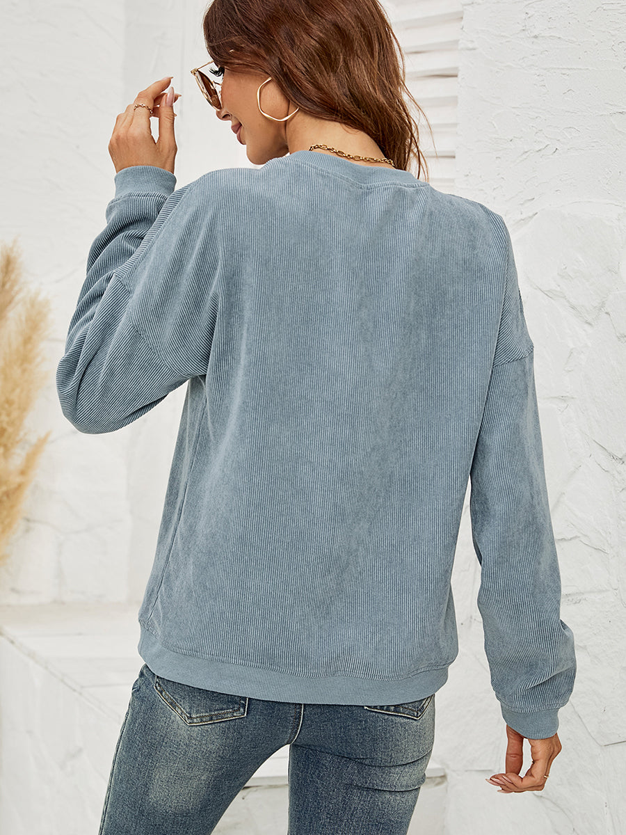 Textured corduroy crewneck sweatshirt in French Blue with crew neck and long sleeves.