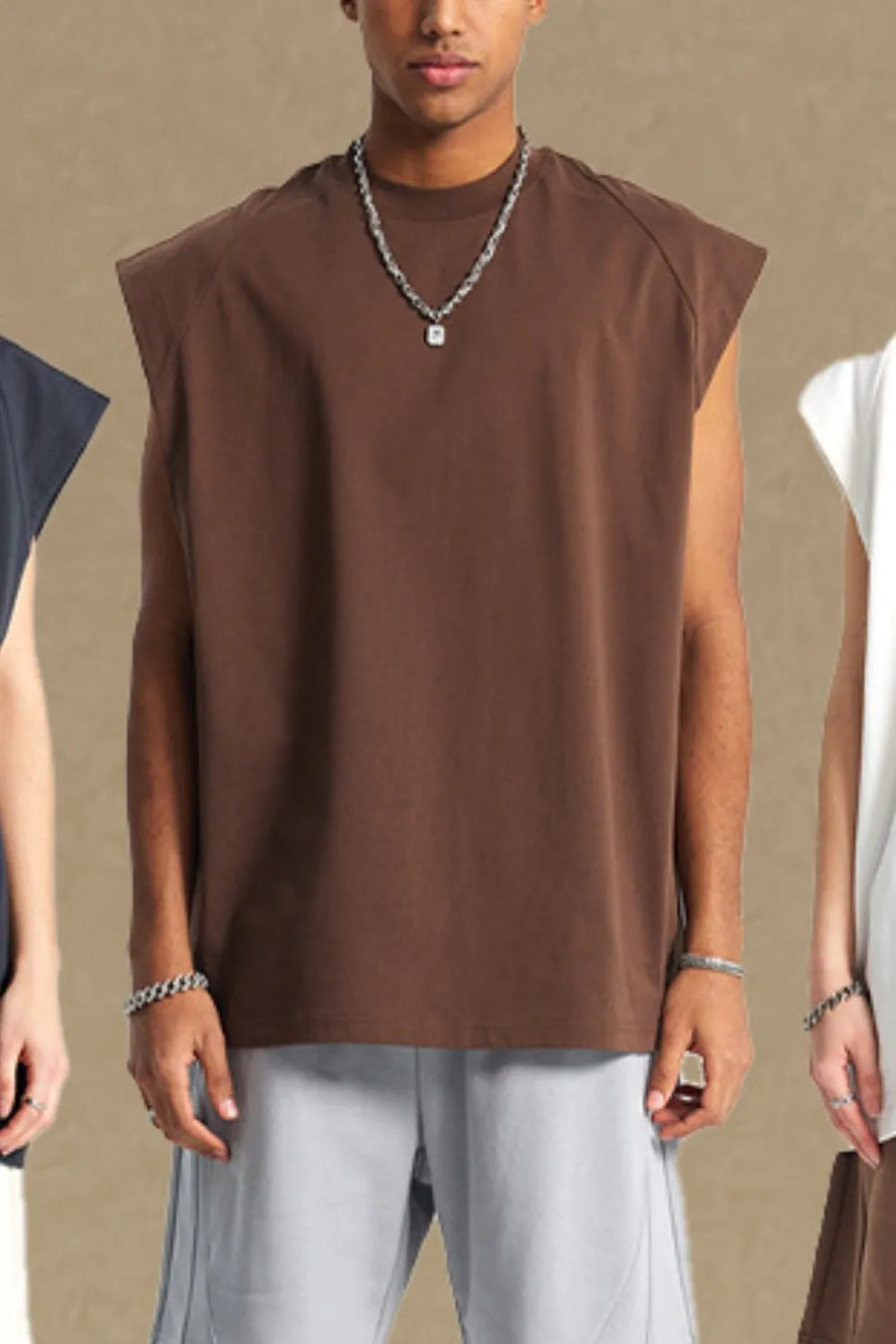 Brown raglan shoulder sleeveless top with crew neck, styled casually.