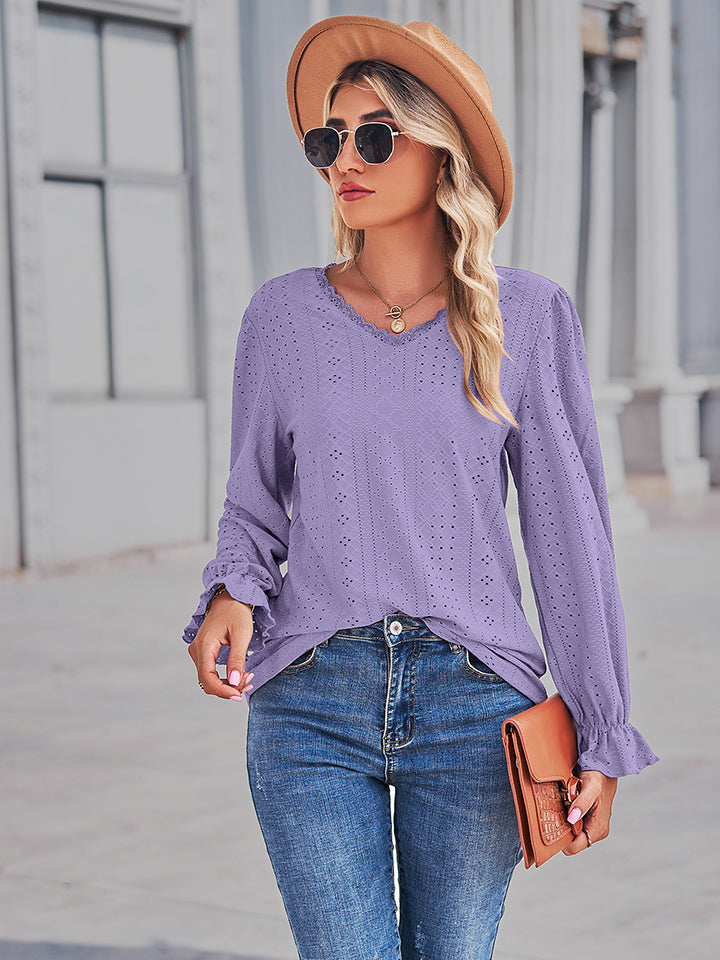 Lavender lace-cut prairie blouse with v-neck, eyelet details, and ruffled sleeves.