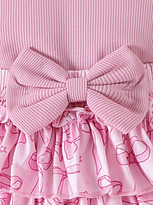 Pink ribbed cotton baby bodysuit with bowknot detail and ruffled skort with bow print