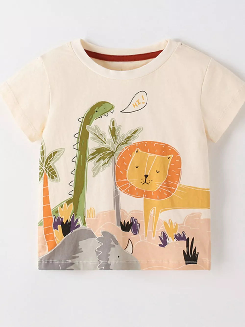 Cream cotton t-shirt with playful cartoon dinosaur and lion graphic, short sleeves, crew neck.