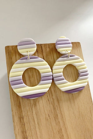Textured rainbow hoop earrings in lavender and yellow stripes with a ribbed detail.