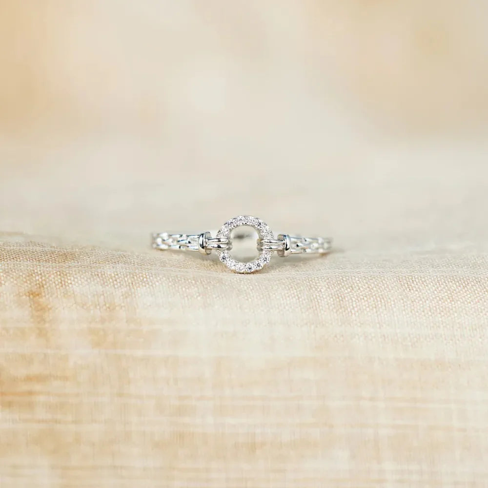 Silver pavé oval chain link ring with intricate detailing.