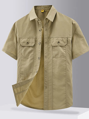 Khaki cotton short-sleeve button-down shirt with two chest pockets and button closure.