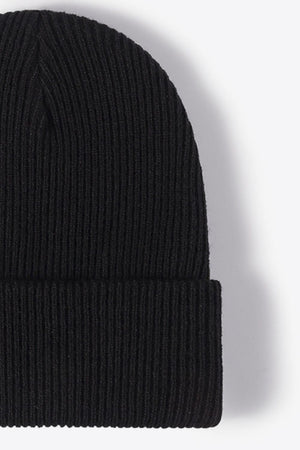 Black ribbed knit beanie with a cuffed hem