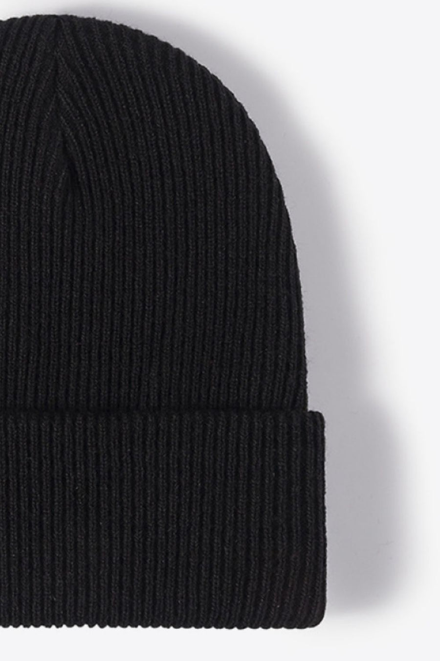 Black ribbed knit beanie with a cuffed hem