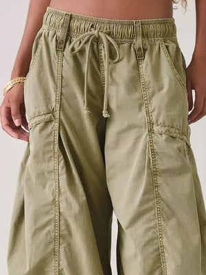 100% polyester Care instructions: Machine wash cold cargo pants in Black with wide-leg silhouette