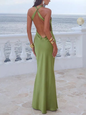 Satin maxi dress in lime green with a deep open back and halter neckline.