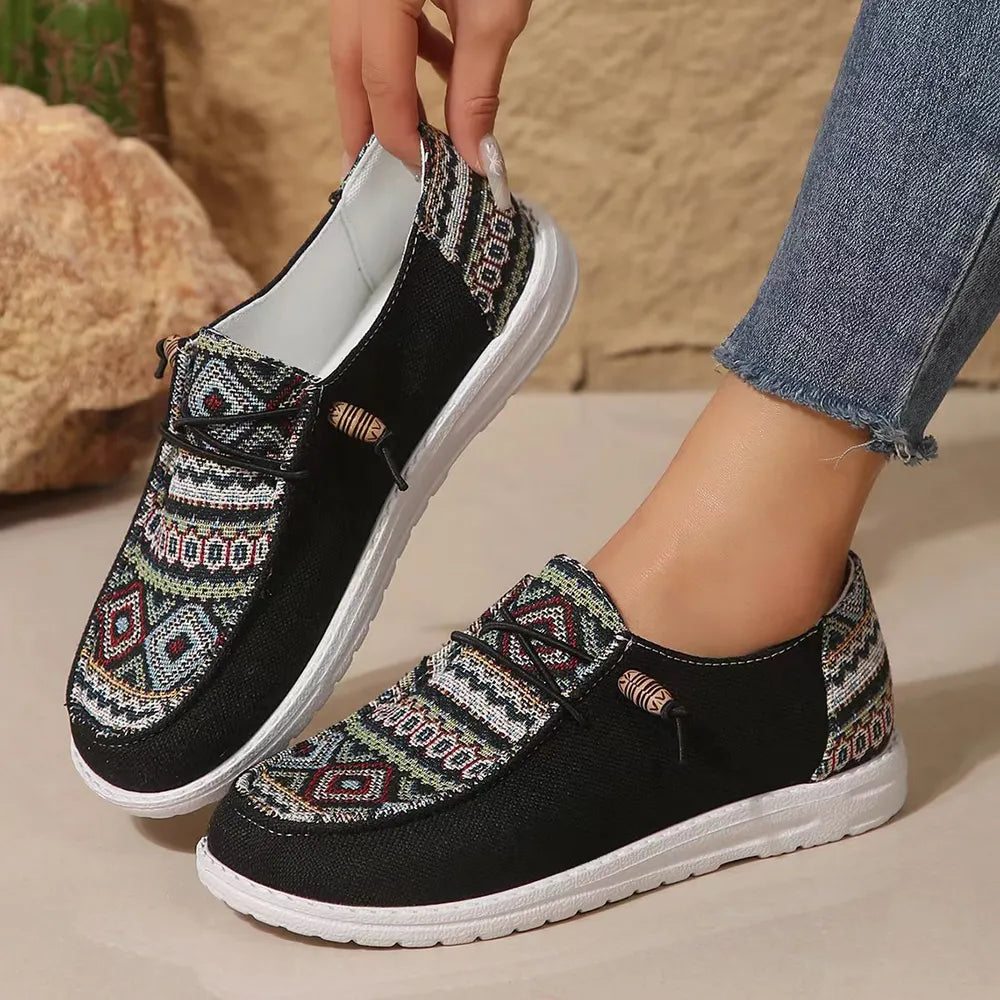 Embroidered canvas slip-on flats with rope detail and geometric pattern