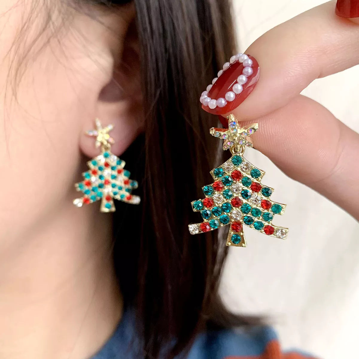 Gold rhinestone Christmas tree earrings with red and teal accents and star topper.