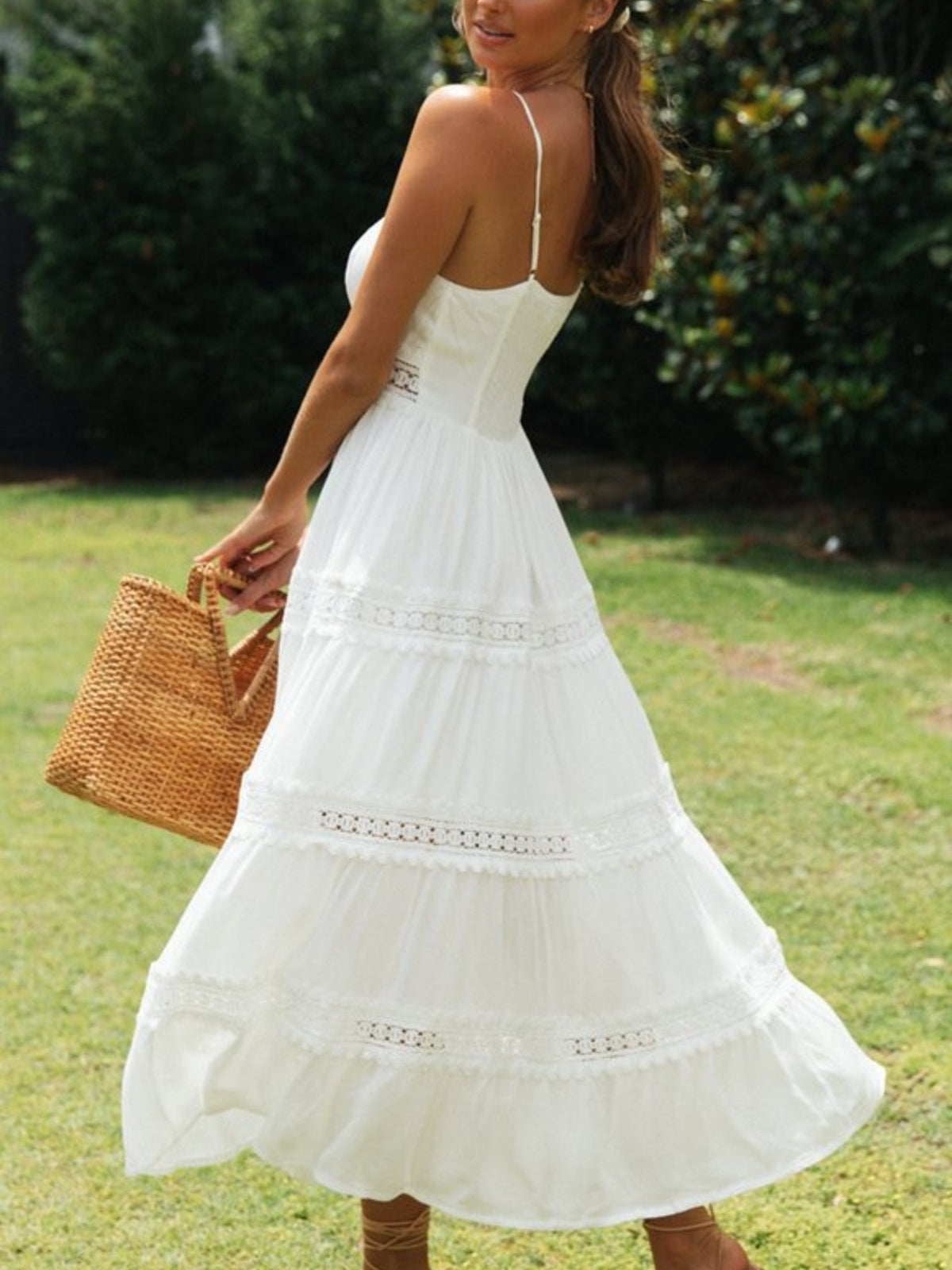 White tiered midi dress with lace trim and spaghetti straps.