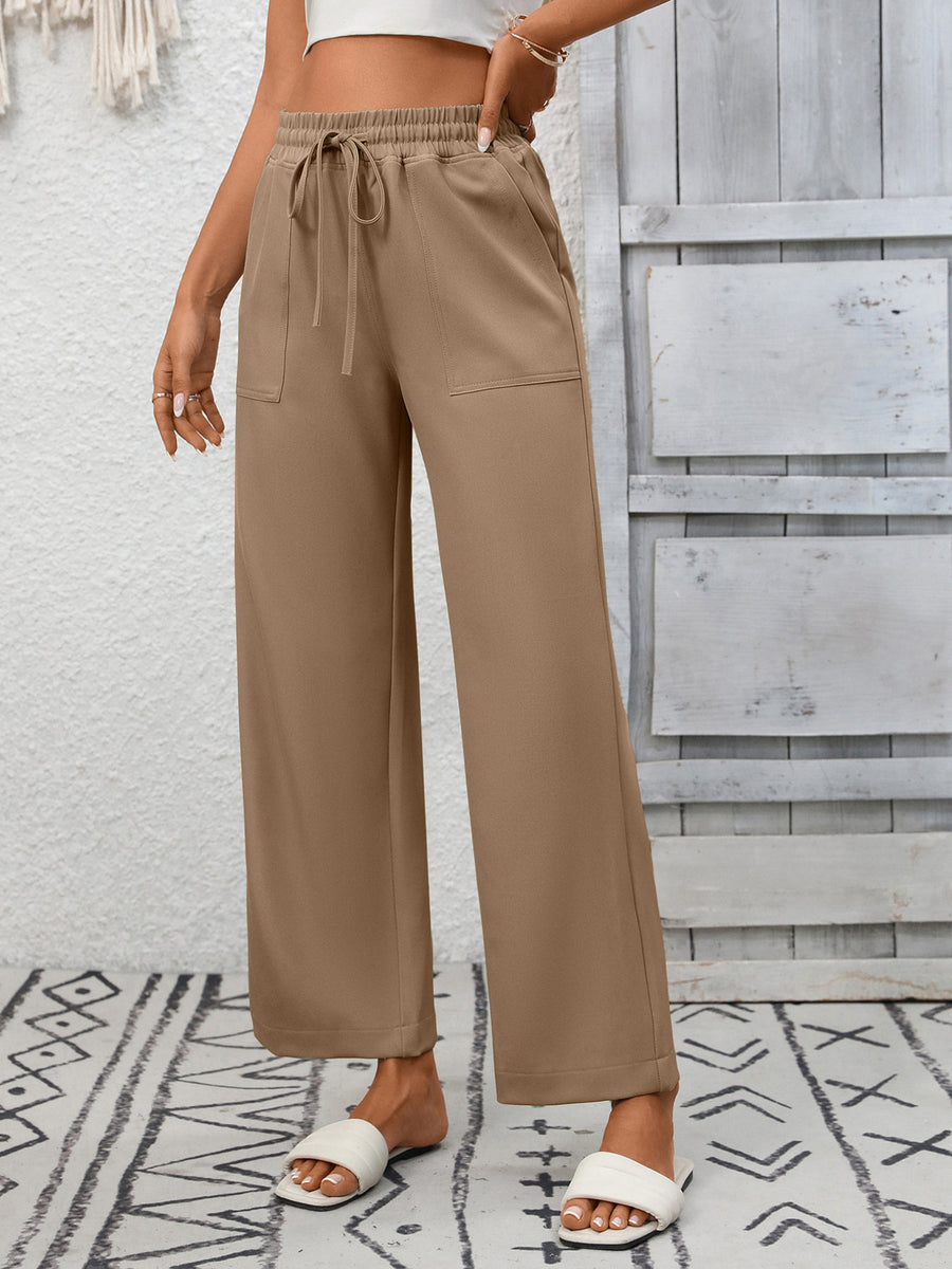 Khaki drawstring wide-leg pants with elastic waistband and pockets.
