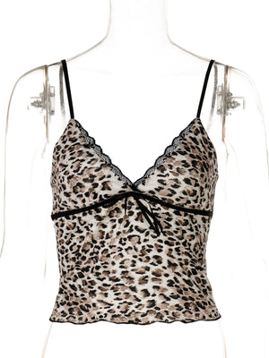 Print lace cami top with leopard pattern, V-neck, adjustable straps, and bow detail.