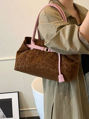 Brown leopard print PU leather shoulder bag with pink trim and strap detail.