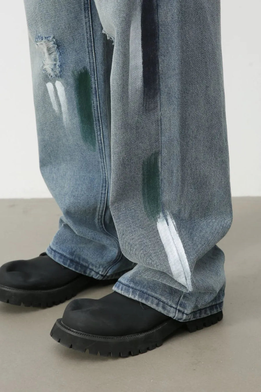 Ink-Blot Wide Leg Denim jeans in medium wash with abstract paint splatters and distressed details.
