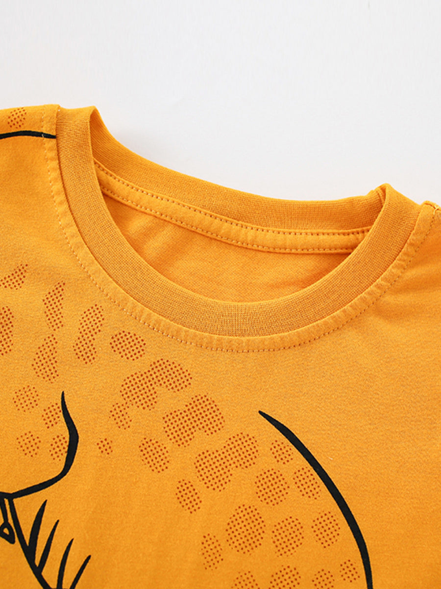 Toddler orange crewneck t-shirt with playful alligator print and dotted texture detail.