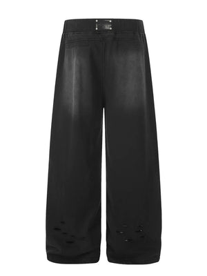 Black distressed wide-leg drawstring sweatpants with ripped hem detail.